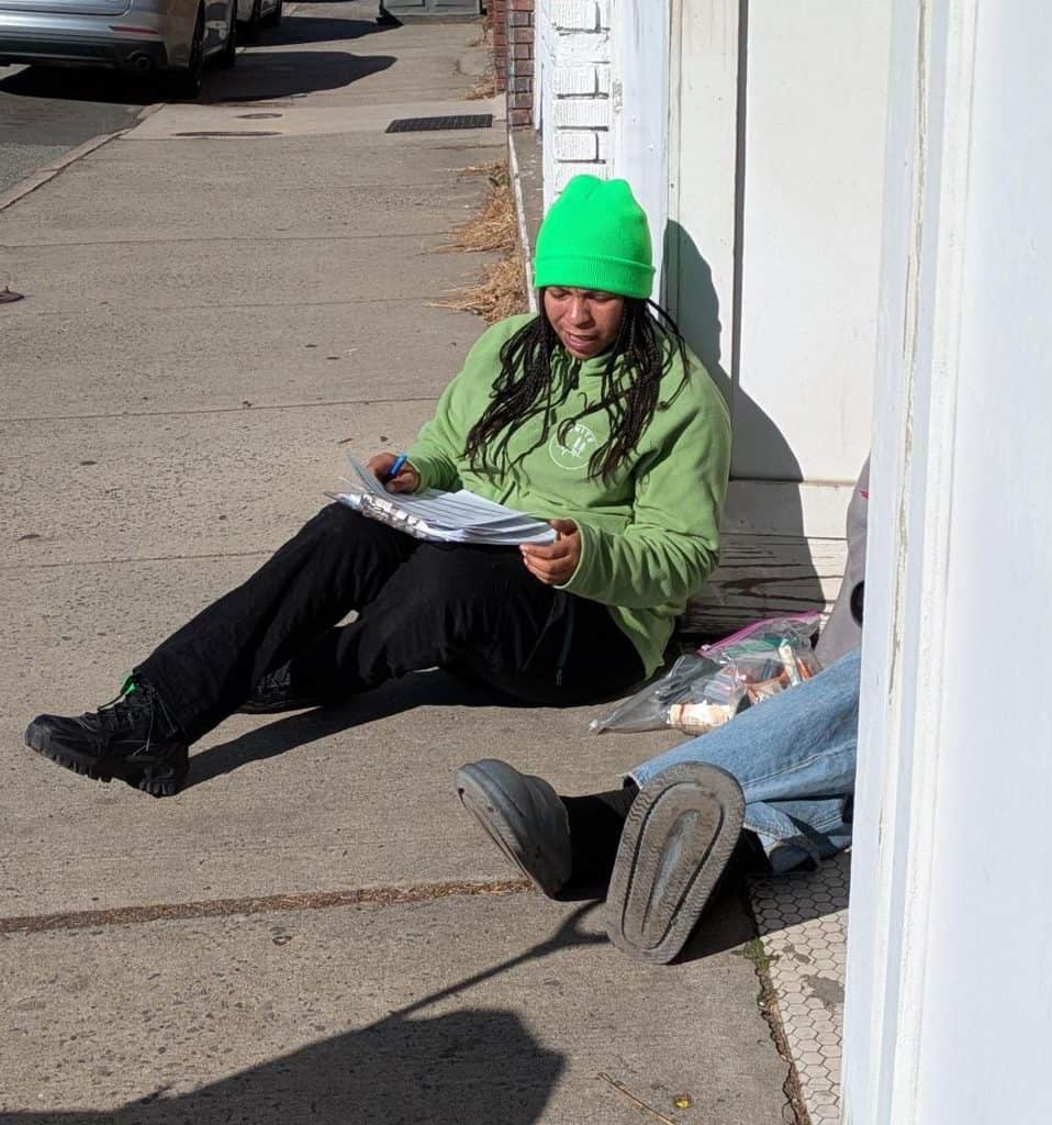 Outreach Specialist completing an intake and learning what supports the unsheltered neighbor needs.